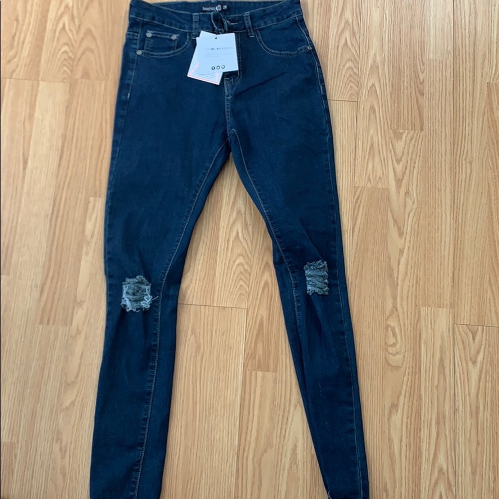 Spray on skinny jeans with ripped knees